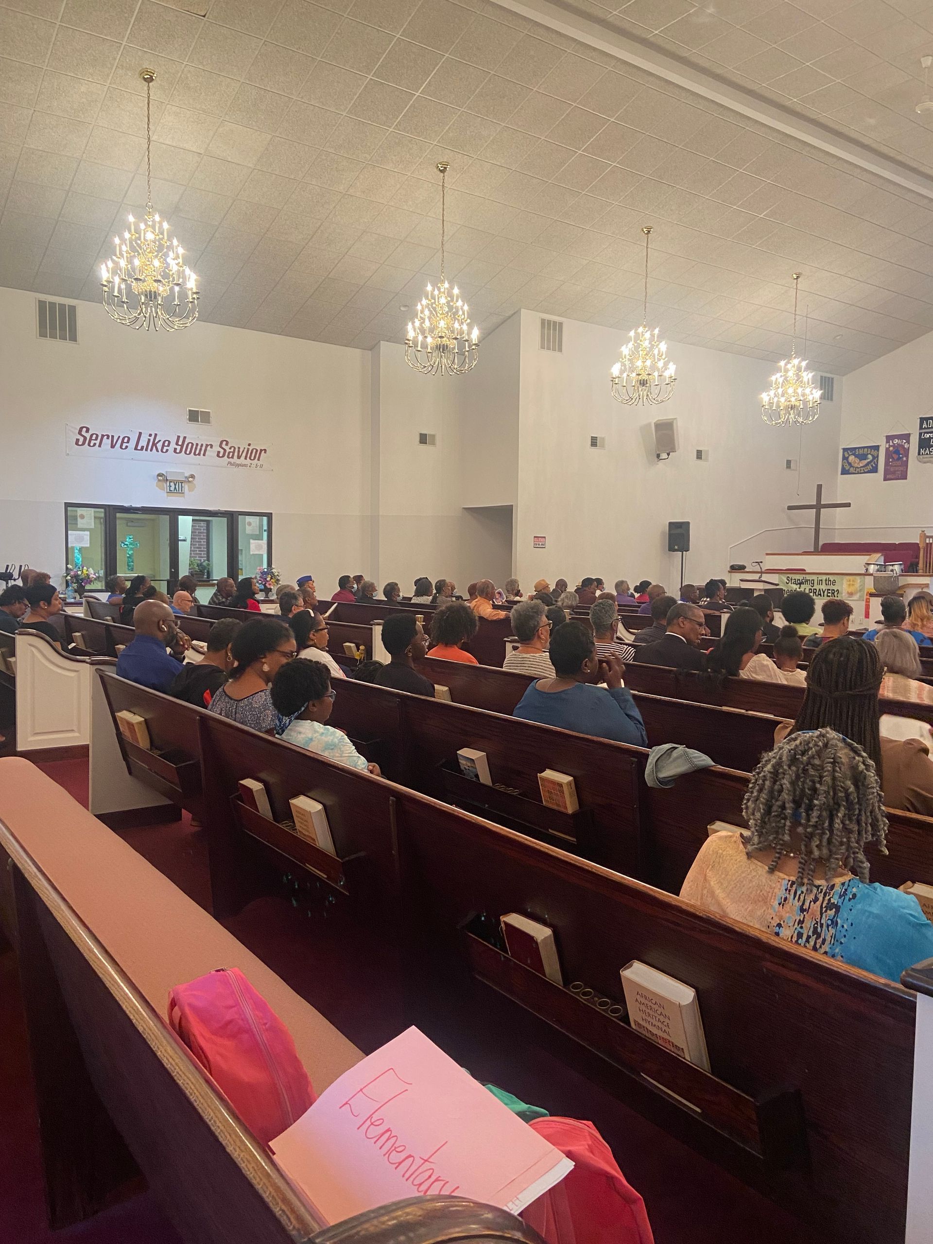 A church with a sign that says serve like your father