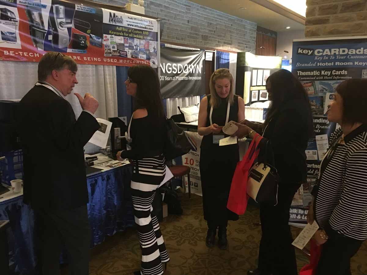 Ken and Lana showing clients our solution to converting VING 2800 locks to new RFID retros at AHLA 2017.