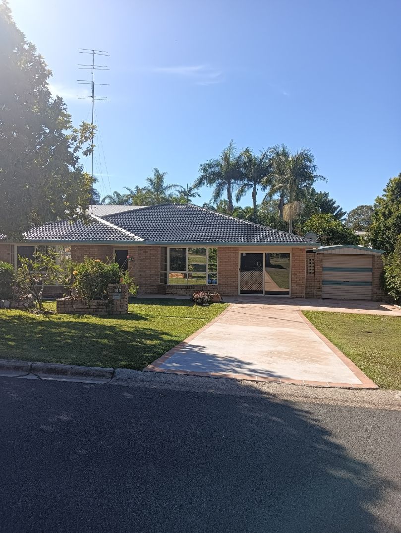 A Brick House With a Garage and a Driveway in Front of It — A-Z Property Painting In Karuah, NSW
