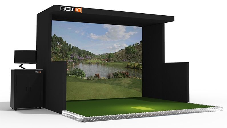 A golf simulator with a large screen showing a golf course.