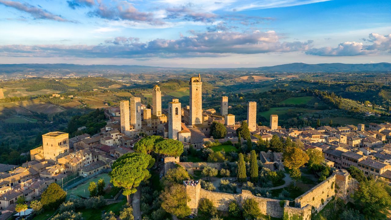San Gimignano towers at sunset during Tuscany Daily Tours excursion from Montecatini