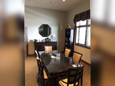 a conference room with a long table and chairs.