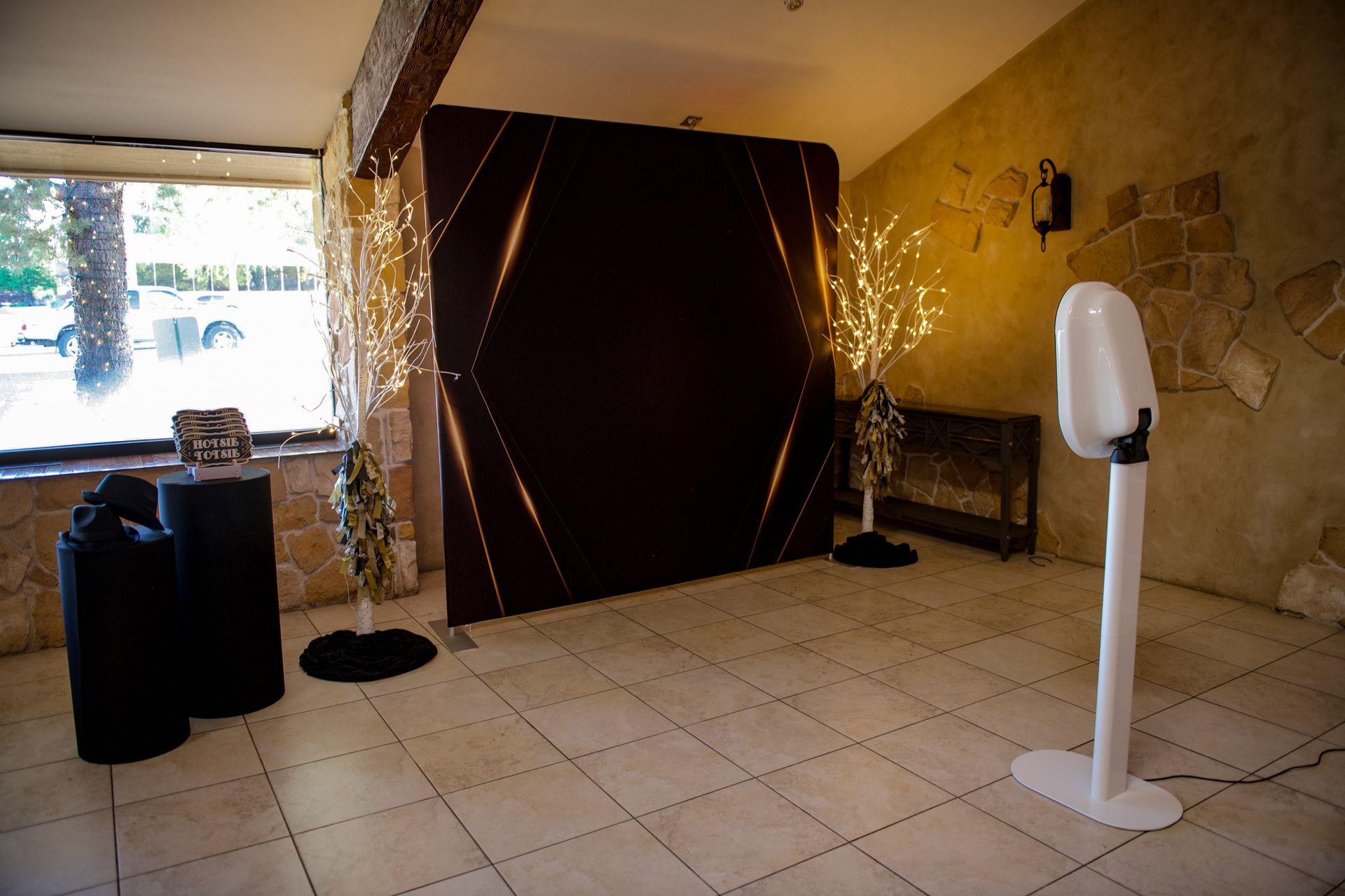 There is a photo booth in the middle of the room.