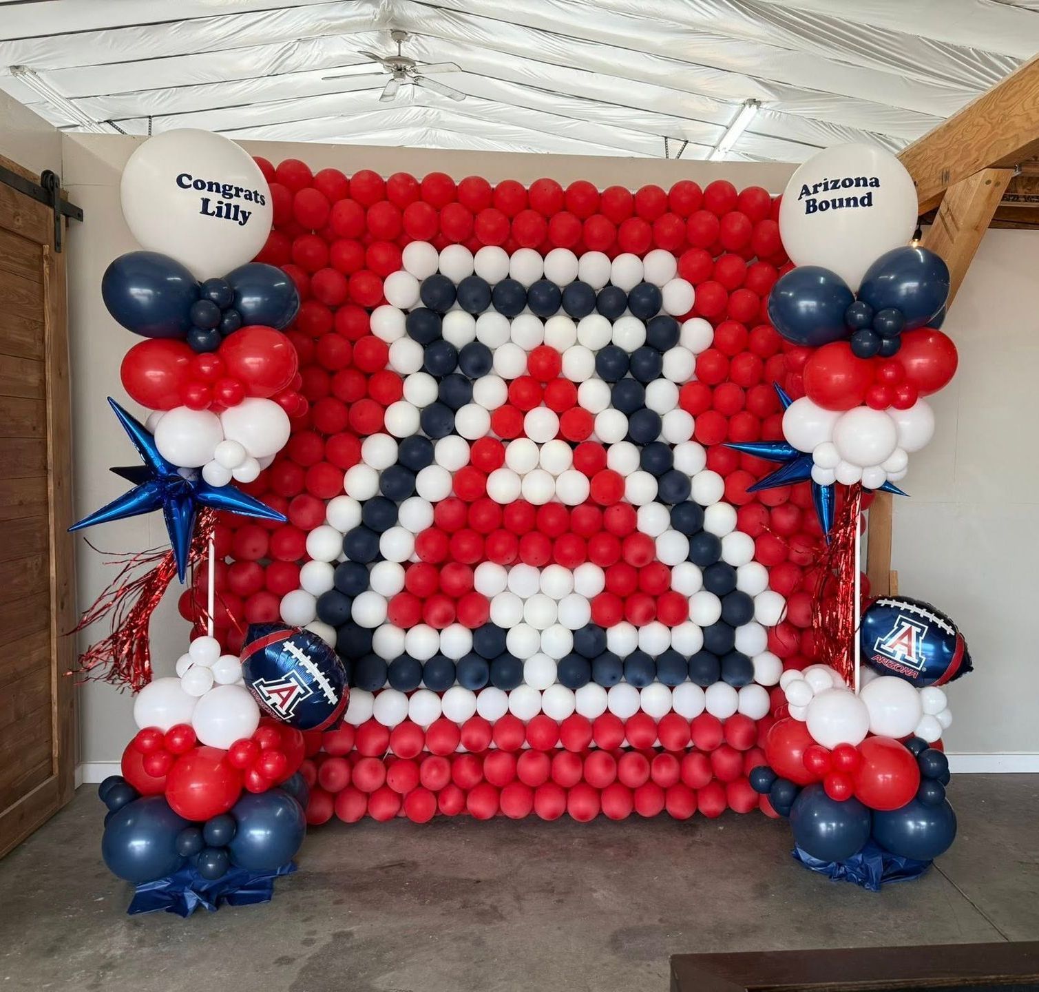 The letter a is made out of red white and blue balloons