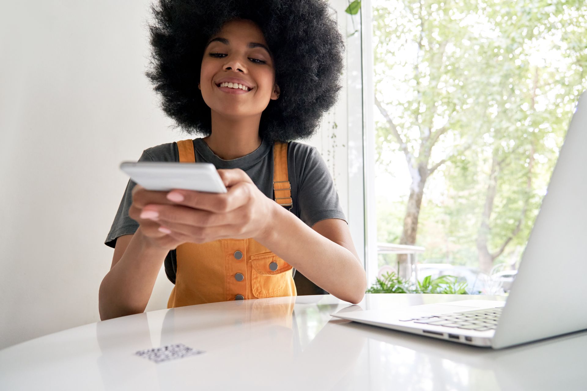 a female student scanning a qr code to see an event availability