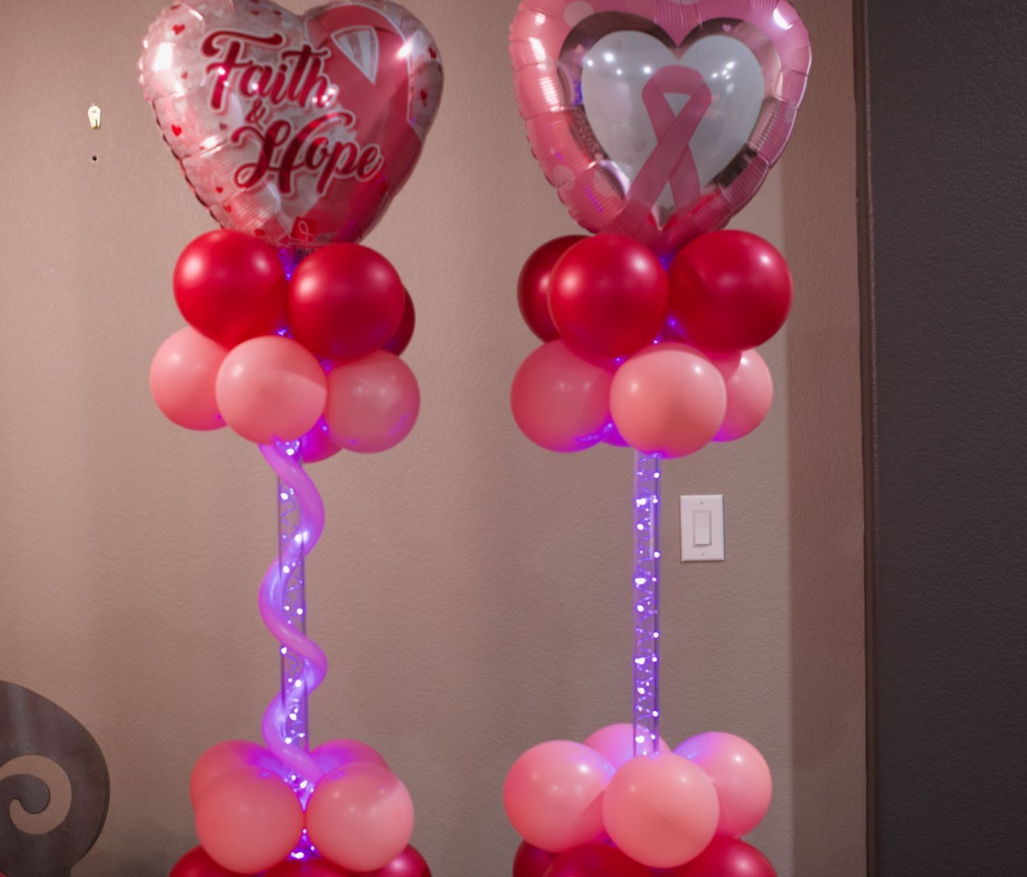 Two balloons with faith and hope written on them