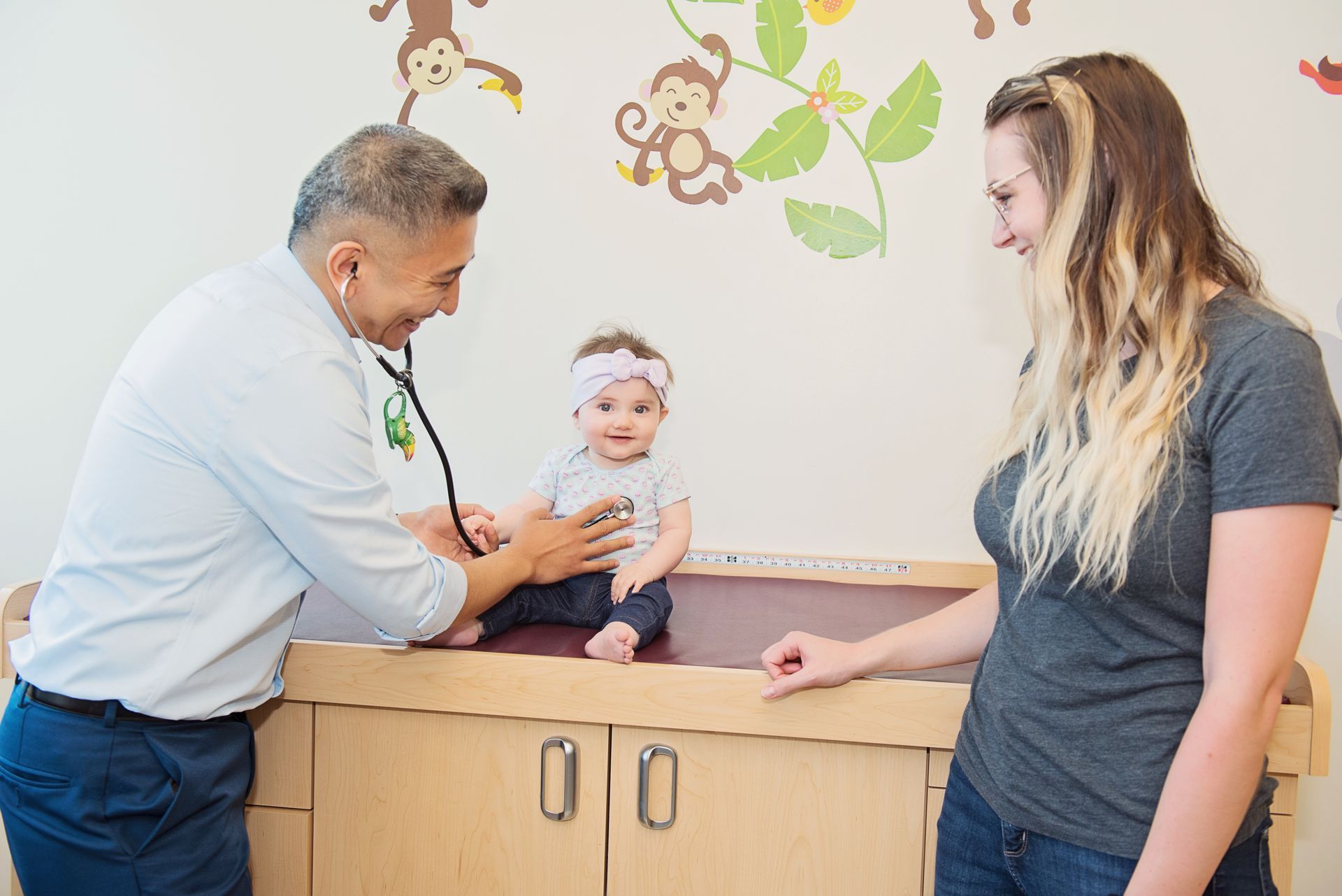 Doctor with baby and mom