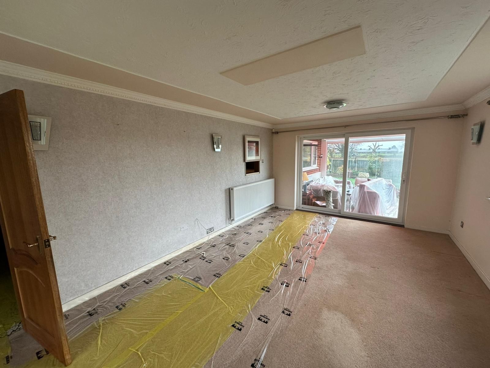 A brick house with a white awning on the side