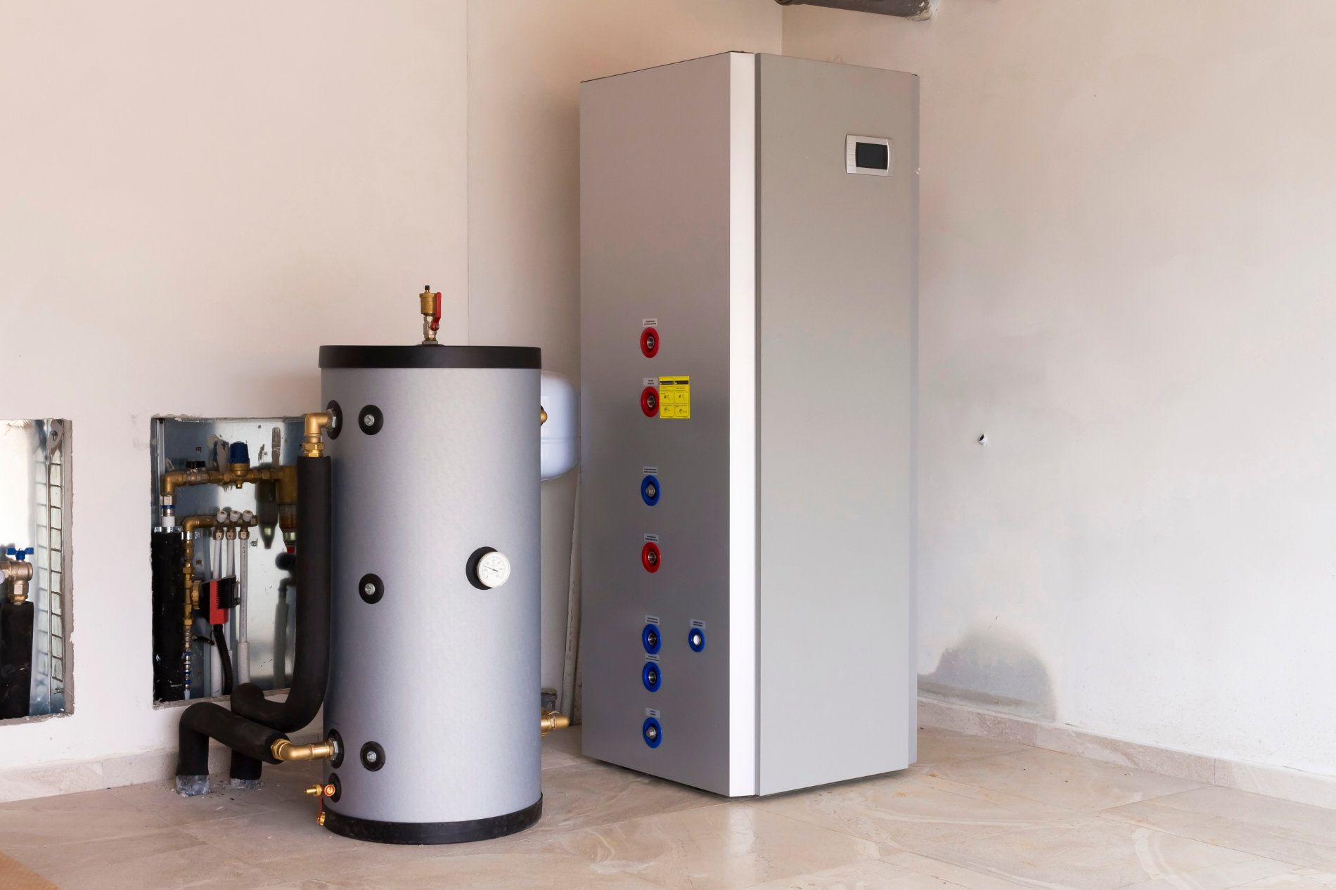 Large Silver Water Heater and Tank in a Room — Taps 'R' Us in Caboolture, QLD