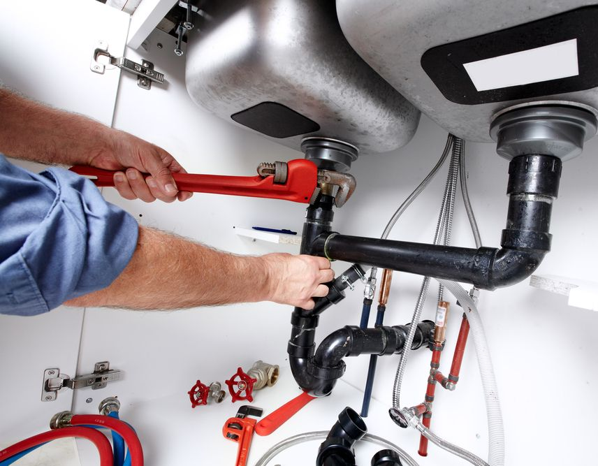 Plumber Using a Wrench to Repair a Sink — Taps 'R' Us in Palmview, QLD