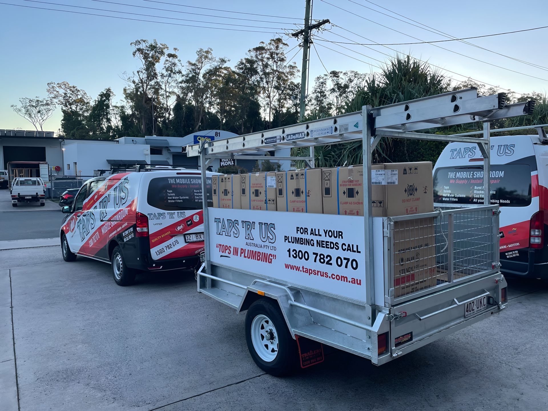 A Trailer Loaded With Boxes Attached to a Van — Taps 'R' Us in Kunda Park, QLD