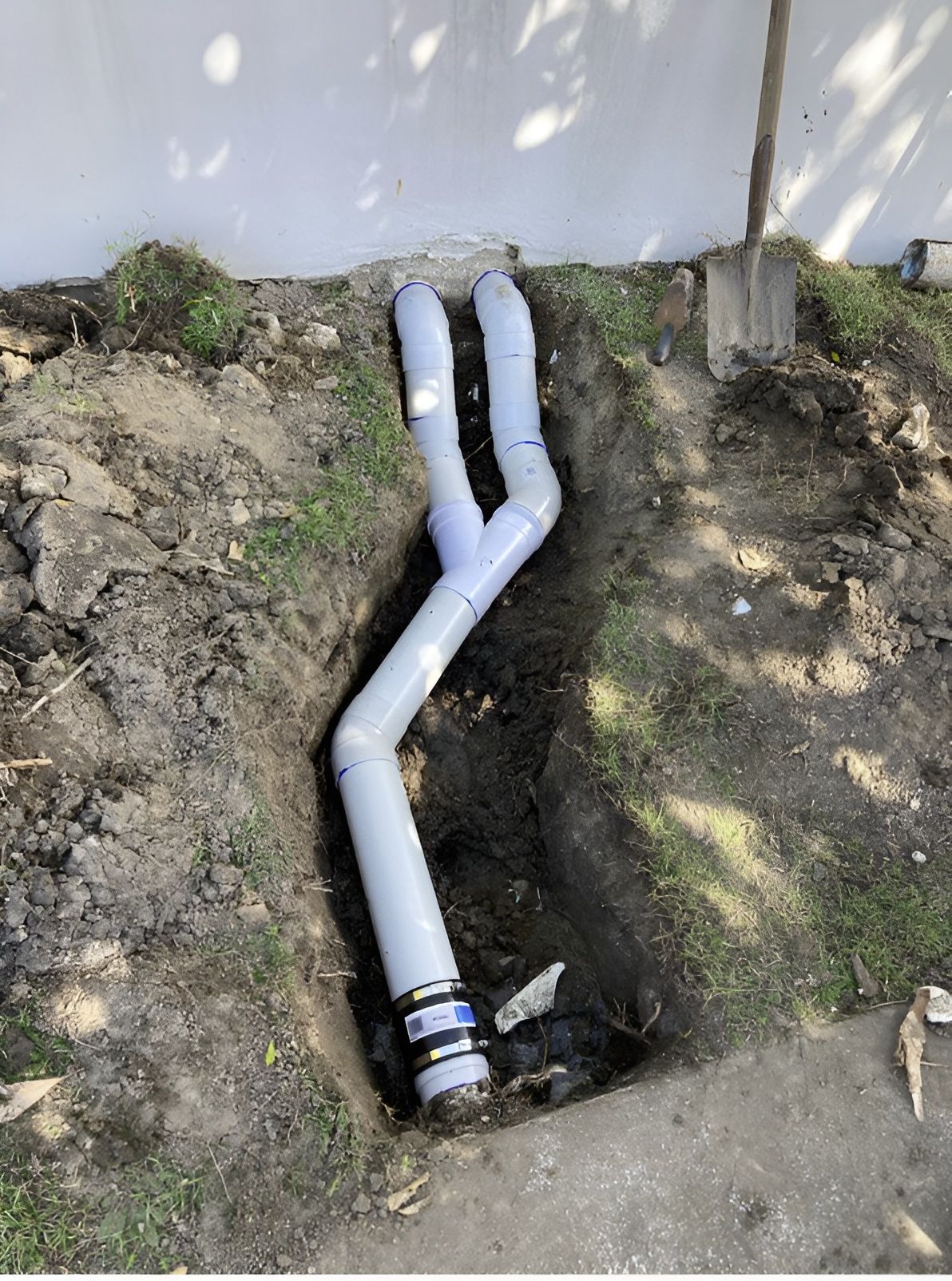 Gray PVC Pipes in a Dug Trench — Taps 'R' Us in Caboolture, QLD