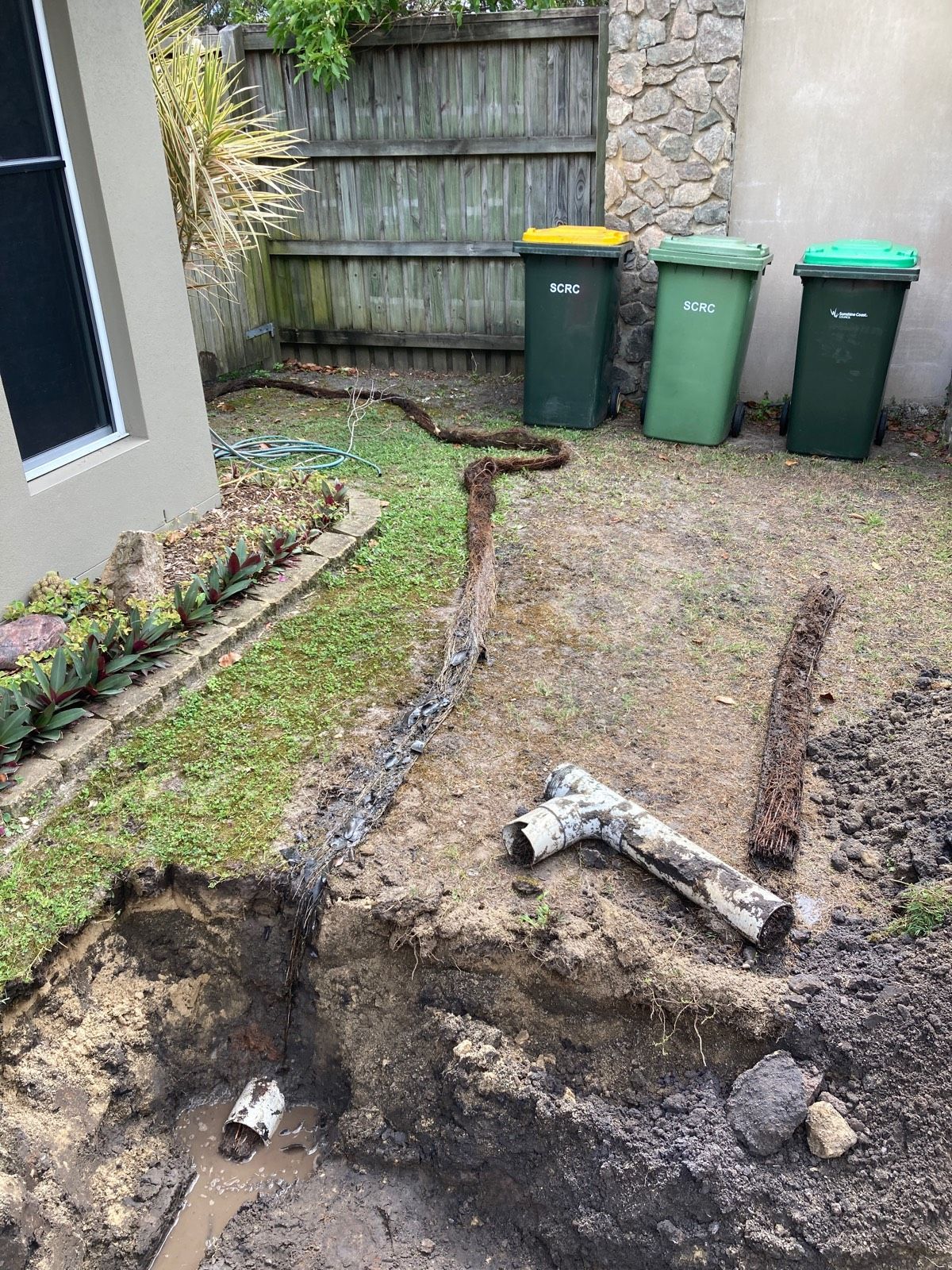 Trench Dug in Yard With Buried Pipes Exposed — Taps 'R' Us in Kunda Park, QLD
