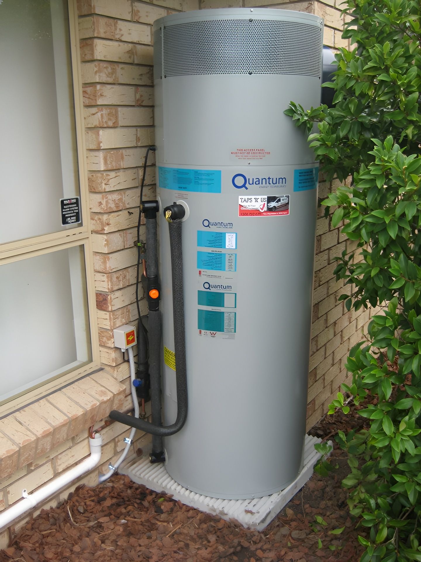 Tall Gray Quantum Hot Water Heater — Taps 'R' Us in Baringa, QLD