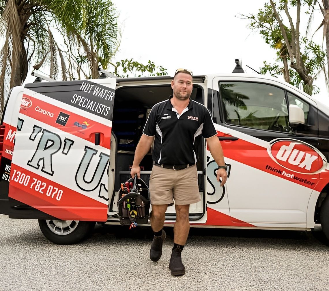 Plumber Exiting a Van, Carrying Tools — Taps 'R' Us in Kunda Park, QLD