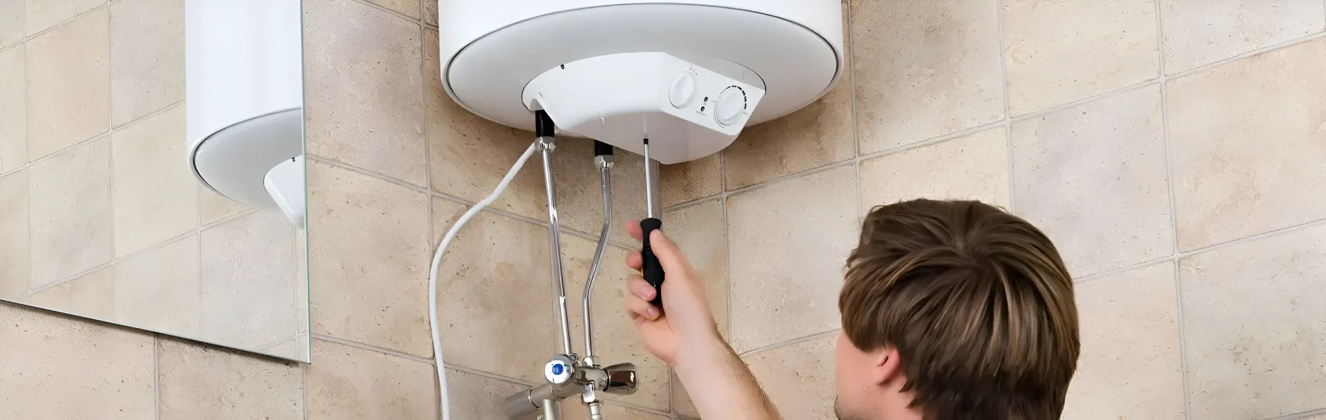 A Person is Repairing a Water Heater With a Screwdriver — Taps 'R' Us in Wurtulla, QLD