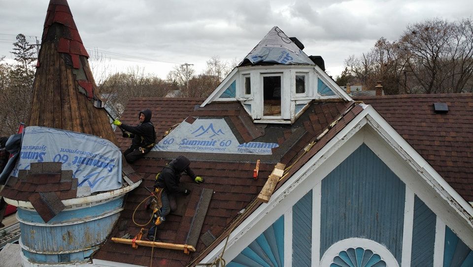 Roofing Experts on Roof — Wausau, WI — CW Custom Exteriors