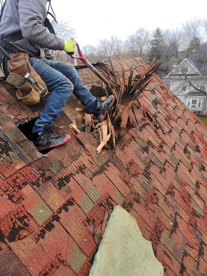 Worker Demolishing the Old Roof — Wausau, WI — CW Custom Exteriors