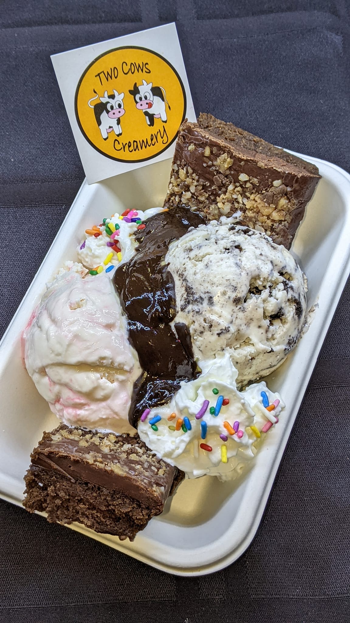 There are many different types of desserts in this container.