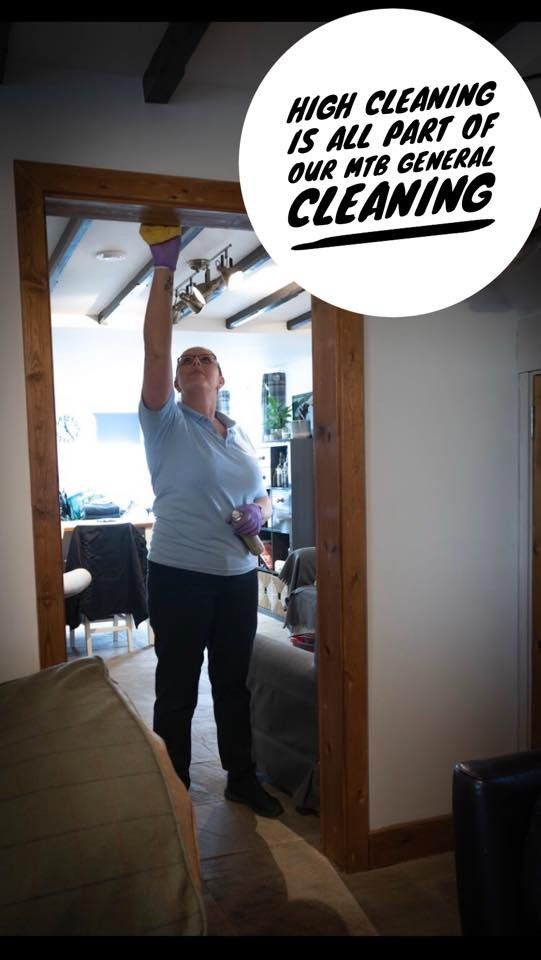 Maid to Butler cleaner cleaning a mirror