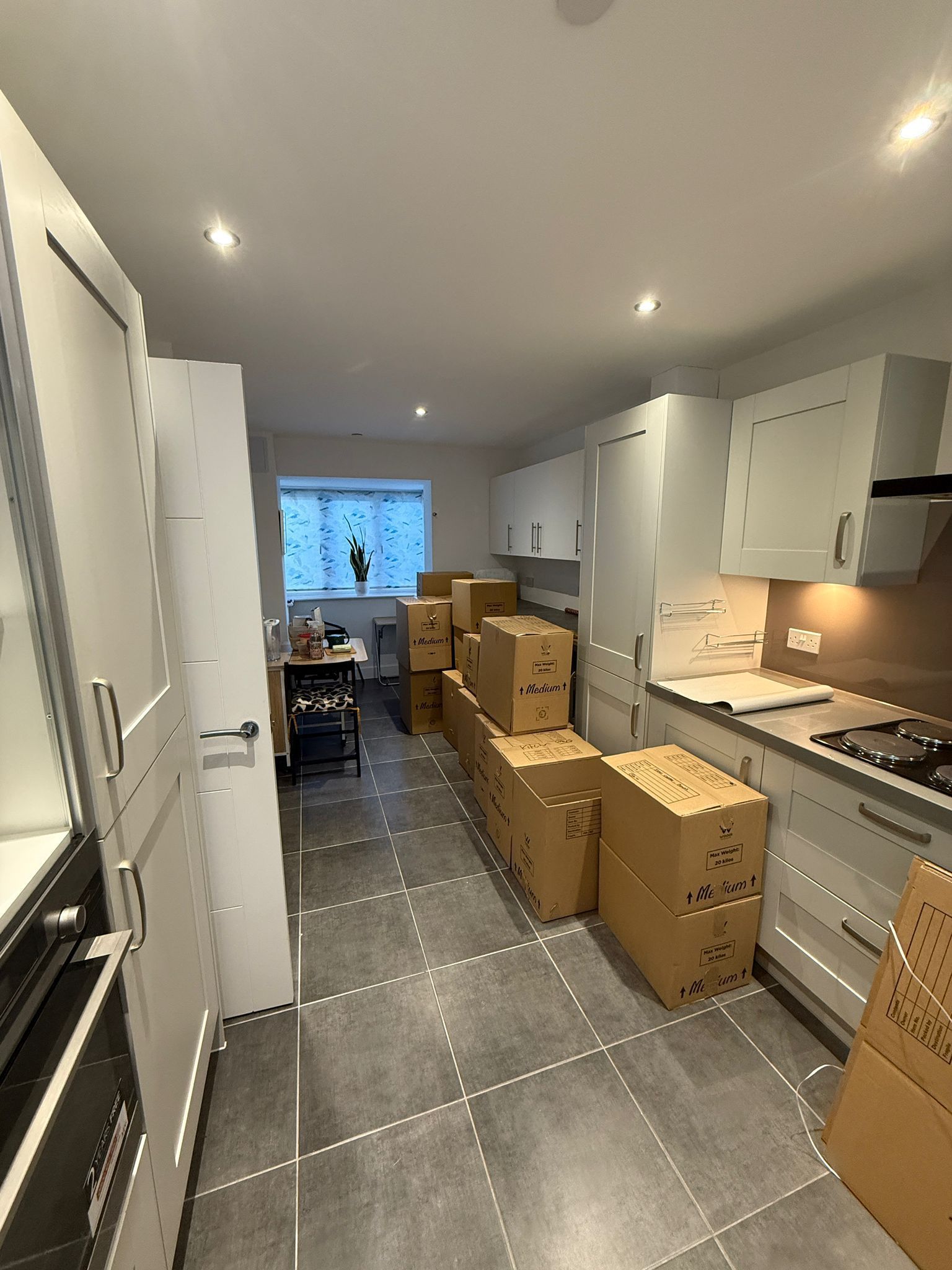 Boxes stacked inside a truck, labeled 