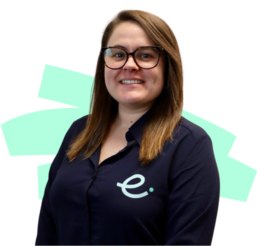 A woman wearing glasses and a blue shirt with the letter e on it.