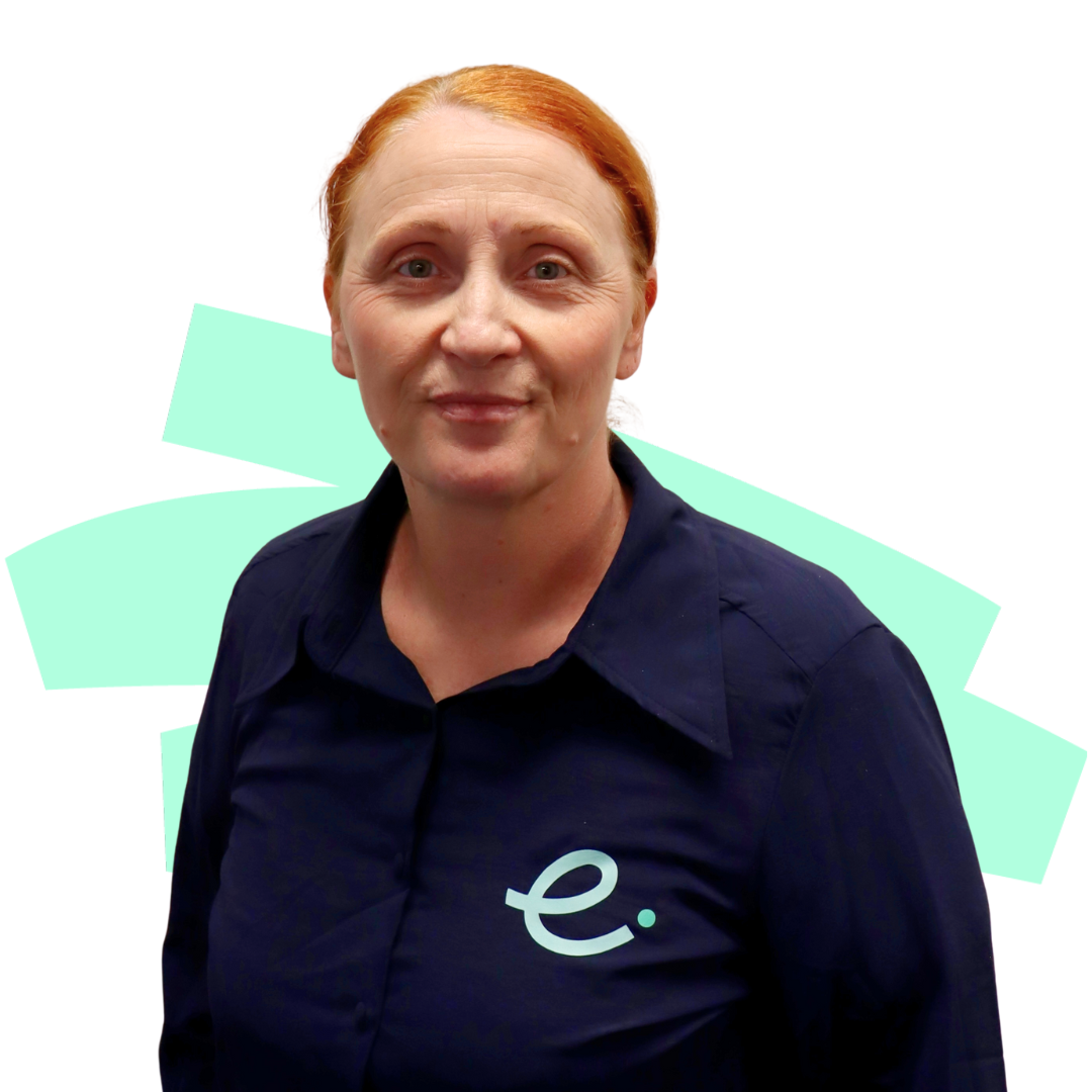 A woman wearing a blue shirt with the letter e on it