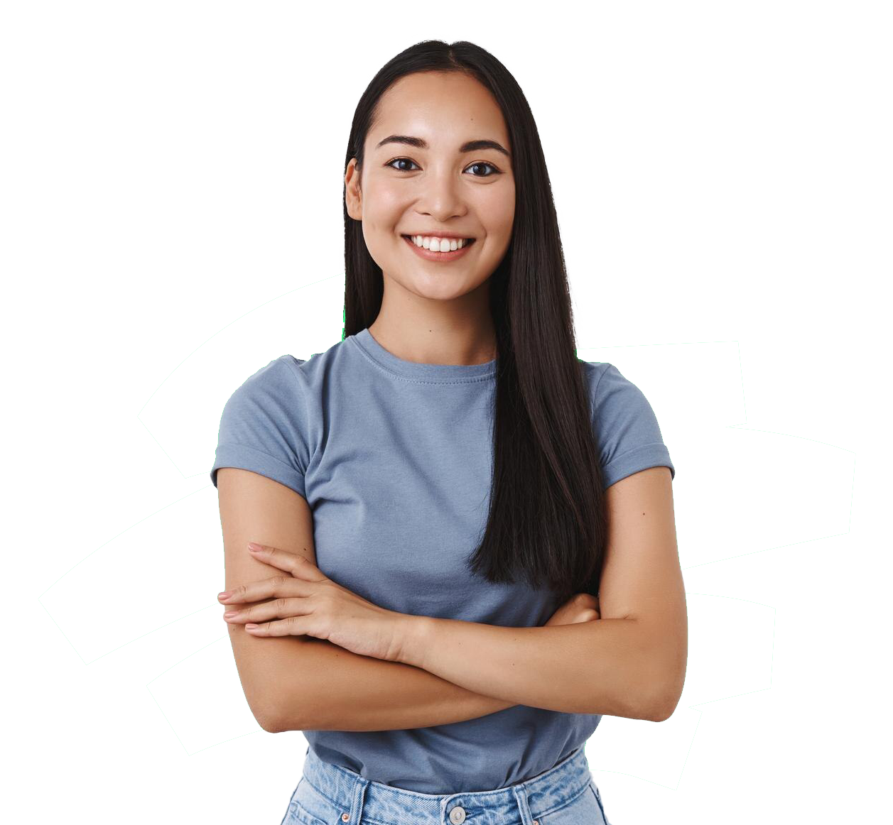 A woman in a blue shirt and jeans is standing with her arms crossed and smiling.