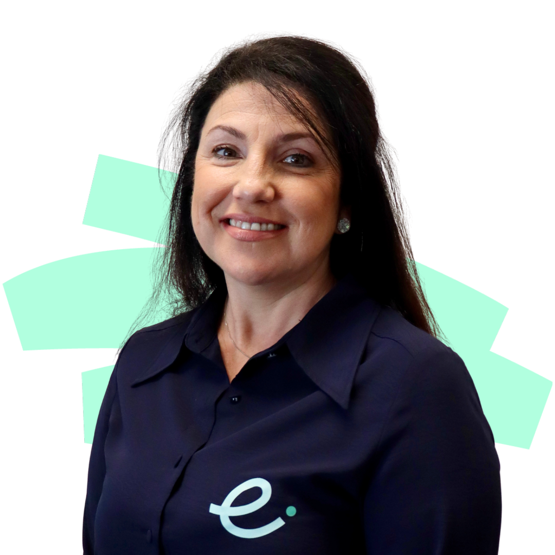 A woman wearing a blue shirt with the letter e on it