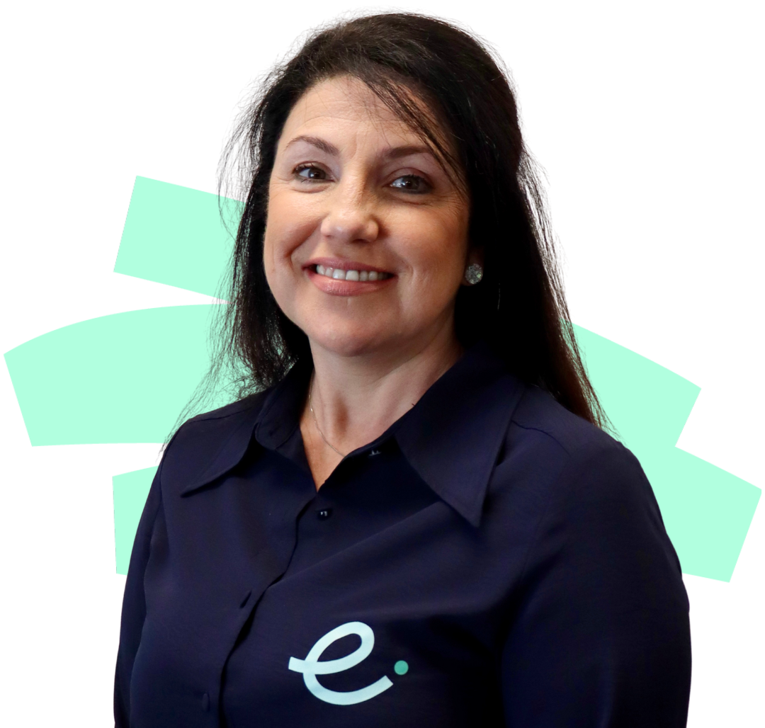A woman wearing a blue shirt with the letter e on it