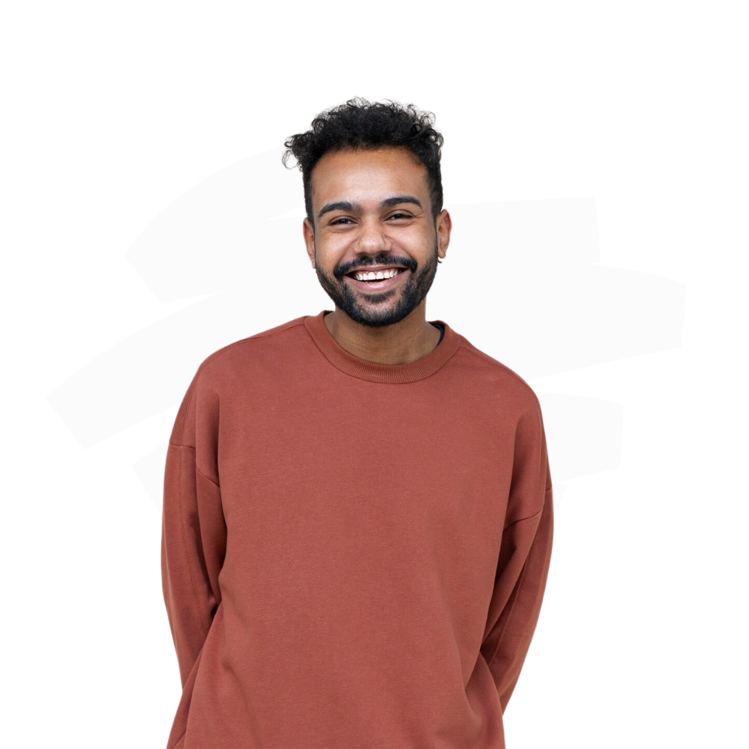 A man with a beard is wearing a red sweater and smiling