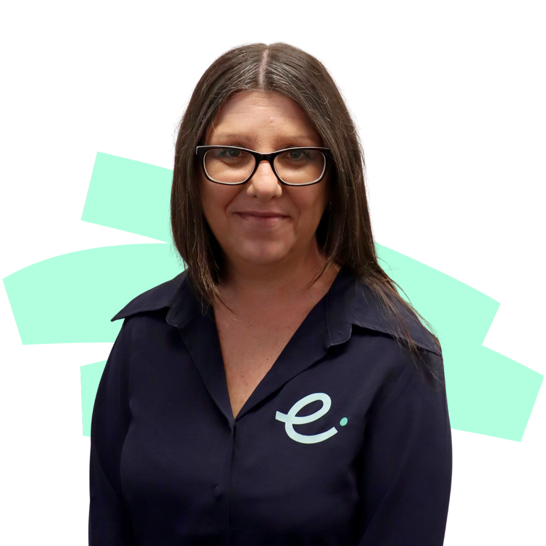 A woman wearing glasses and a blue shirt with the letter e on it.