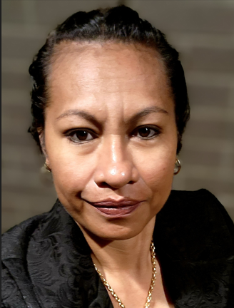 A close up of a woman 's face with a gold chain around her neck