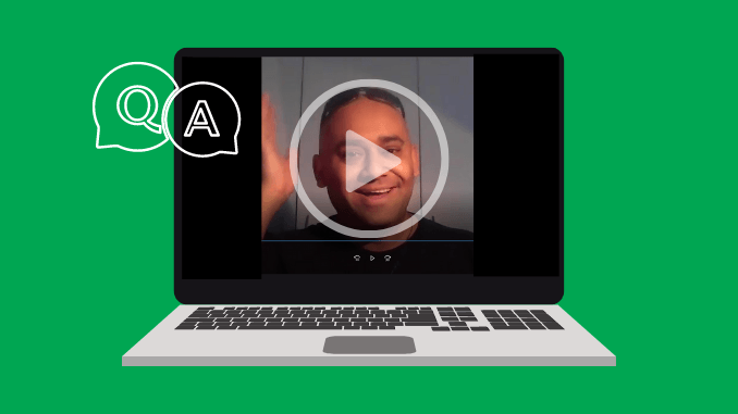 A laptop computer with a video of a man on the screen.