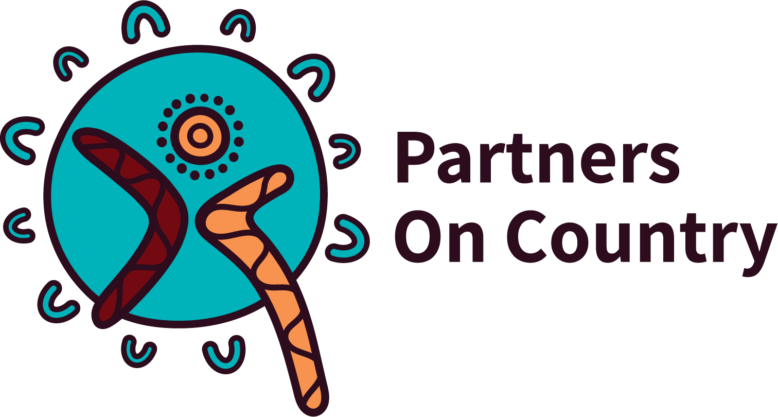 A logo for partners on country with a boomerang in the middle of a circle.