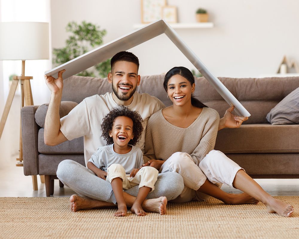 Happy Family in Living Room — Cartersville, GA — 1st Georgia Home Mortgage