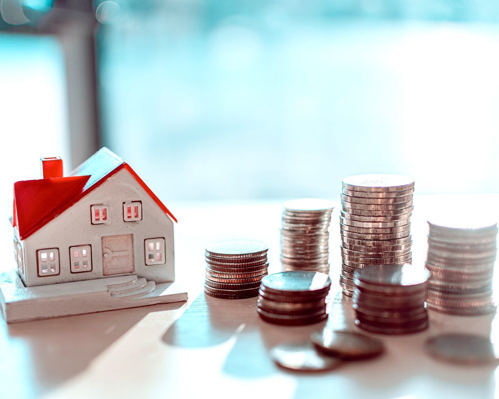 Miniature House and Coins — Cartersville, GA — 1st Georgia Home Mortgage