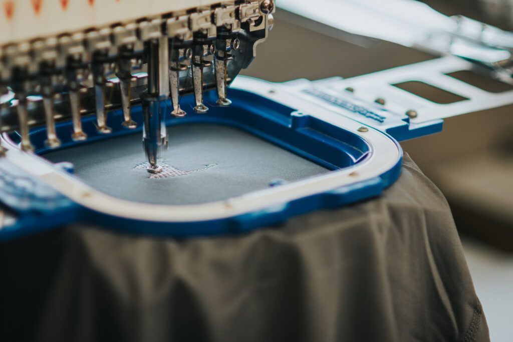 A close up of a sewing machine sitting on top of a table.