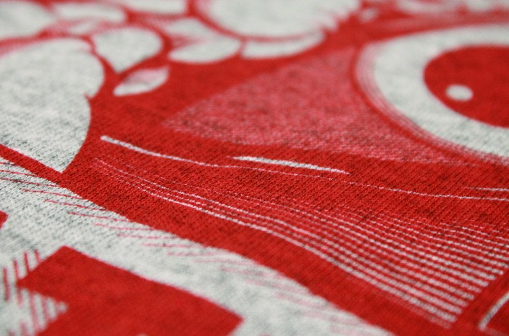 A close up of a red and white t-shirt