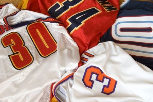 A bunch of jerseys with the number 30 on them