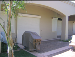 House with Rolling Shutter Door - Window Treatments in Cathedral City, CA