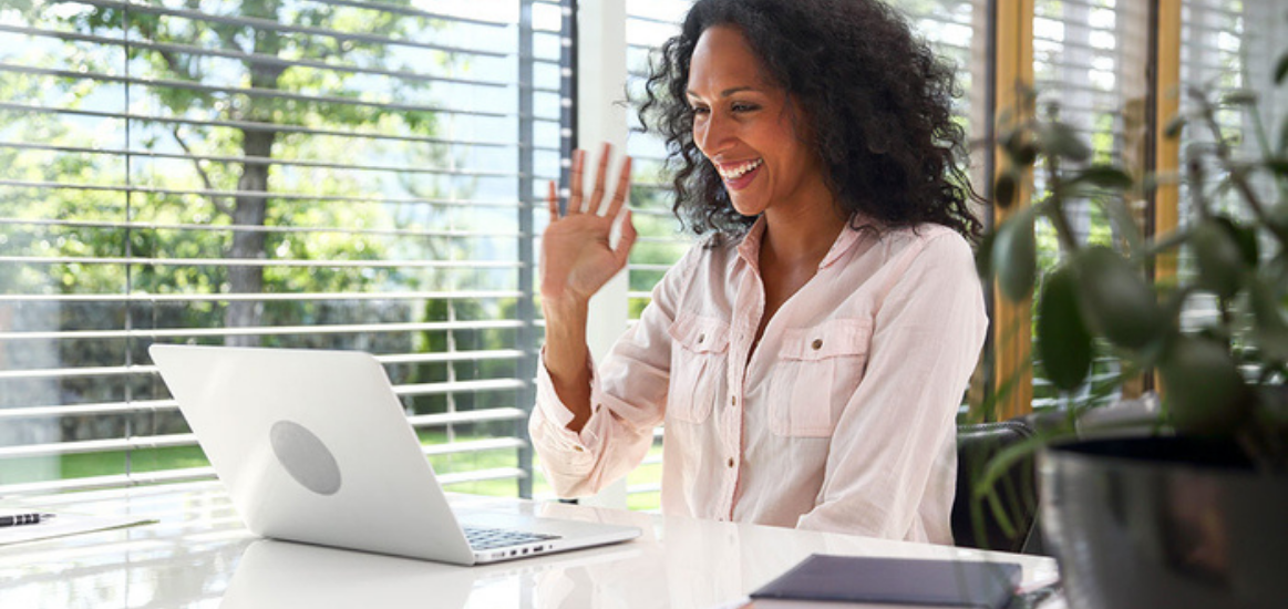 A field of grass with a sunset in the background.