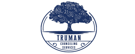 The logo for truman counseling services shows a tree in a circle.