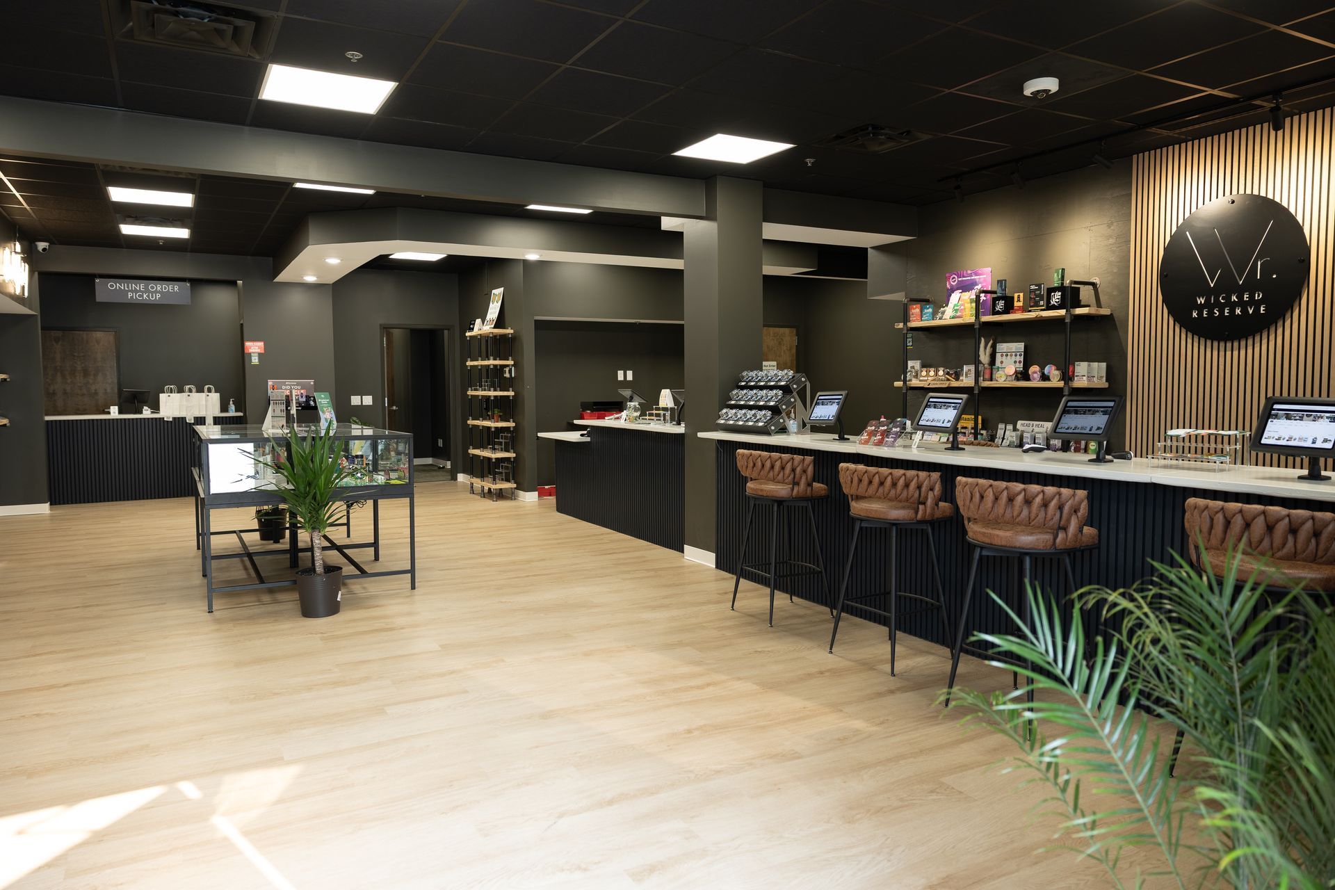 Six-stool bar counter at Wicked Reserve where customers sit for one-on-one budtender consultations