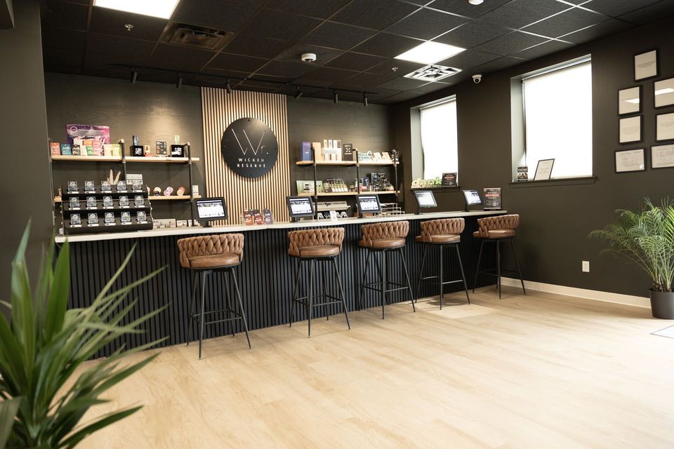 Wicked Reserve bar counter with stools — Rochester NY dispensary