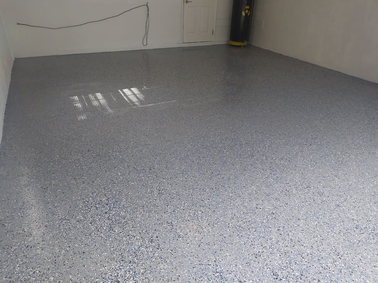 A room with a gray floor and white walls.