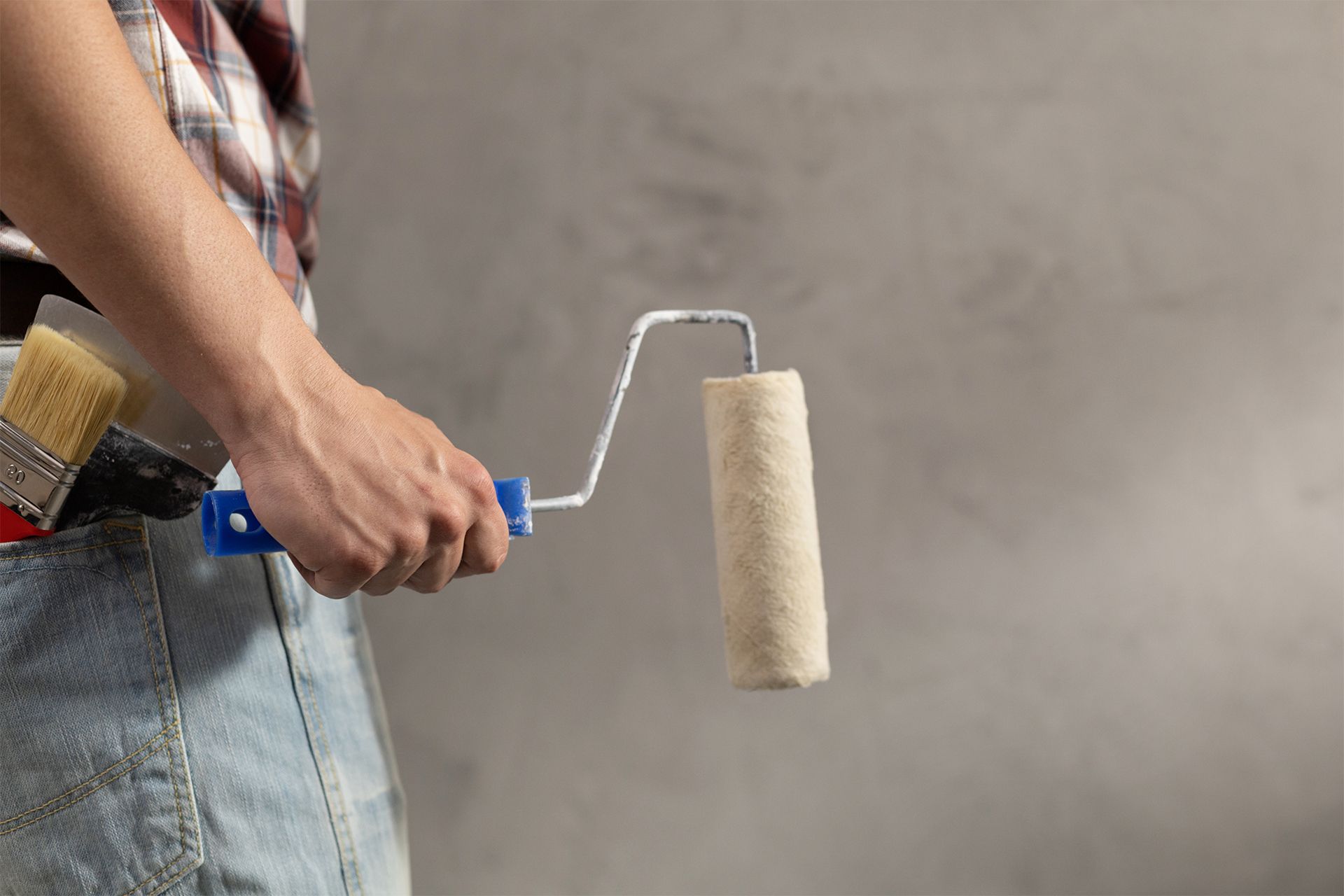 Man Holding a Paint Roller