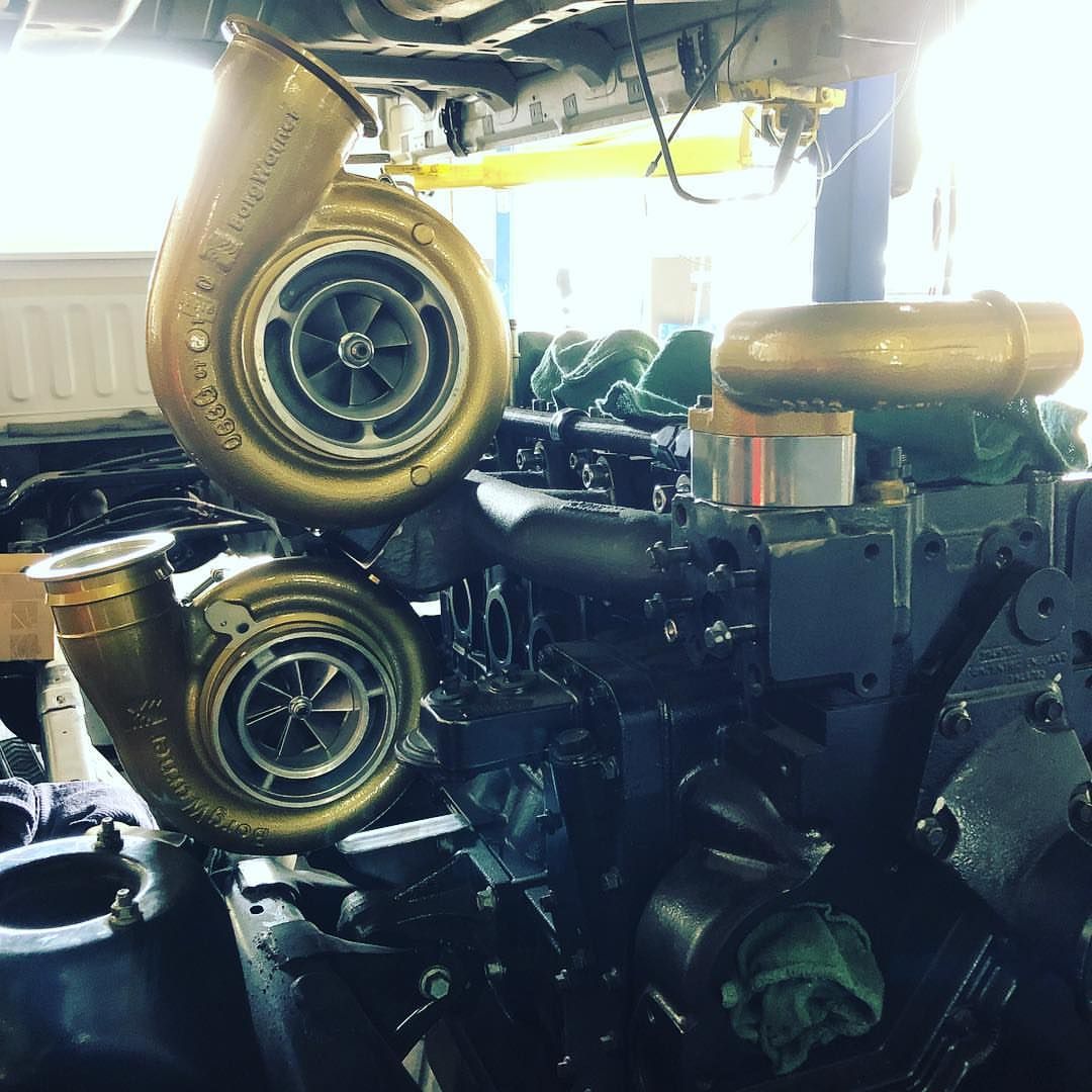 Two turbochargers are stacked on top of each other