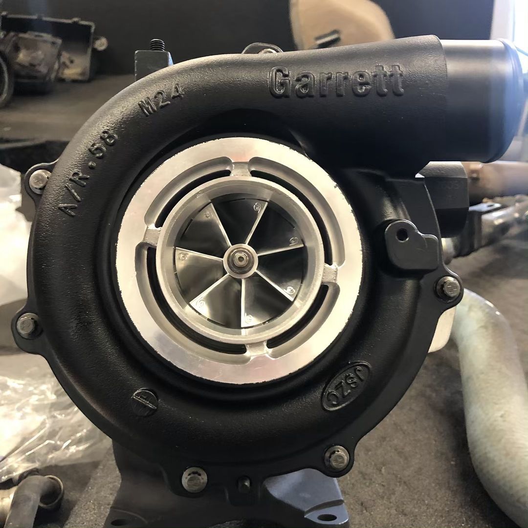 A close up of a garrett turbocharger on a table