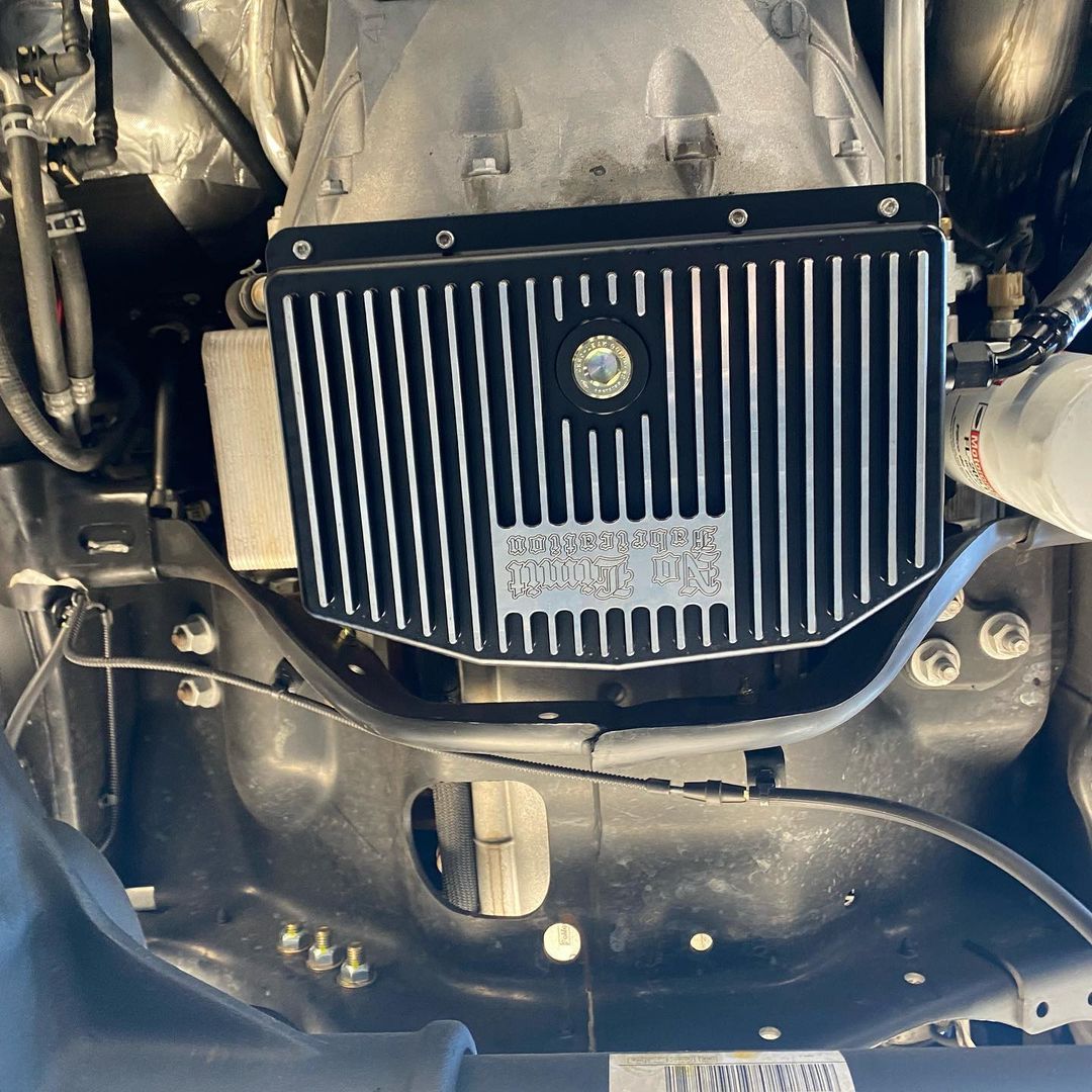 A close up of the underside of a car engine